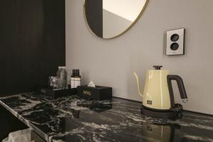 Příslušenství pro přípravu čaje a kávy v ubytování H Avenue Hotel Sangmu Branch