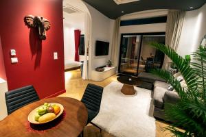 a living room with a table with a bowl of fruit at Riverside Studio in Phnom Penh