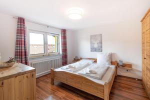 Postel nebo postele na pokoji v ubytování Allgäu-Heimat