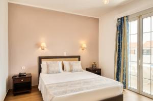Postel nebo postele na pokoji v ubytování Oscar Hotel