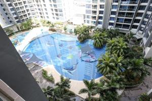 an overhead view of a large swimming pool in a city at Atlantis Residence - Modern Luxury in Melaka