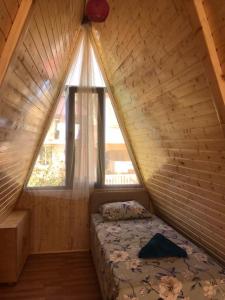 Postel nebo postele na pokoji v ubytování Gonio Chalet.020