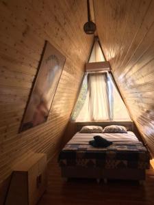 Postel nebo postele na pokoji v ubytování Gonio Chalet.020