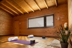 a room with three yoga mats in a room with a window at Borgo Olivo in Pietrelcina
