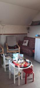 a living room with a table and a couch at Résidence Les Tennis - 4 Pièces pour 8 Personnes 264 in Villard-de-Lans