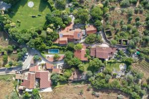 an aerial view of a house with a yard at Villa Pedra Natural Houses in Alvorge