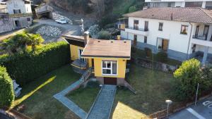 an aerial view of a small yellow house at Villa la Tranquilla in Baveno