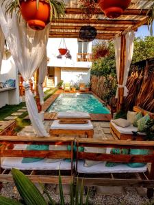 a swimming pool in the middle of a yard at Wander Boutique Hotel in El Paredón Buena Vista