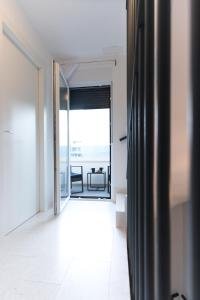 an open door to a room with a balcony at Holiday House Maze with jacuzzi in Novalja +34 photos