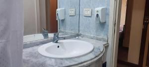 a bathroom with a white sink and a mirror at St George Hotel Cairo in Cairo +50 photos
