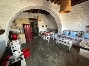 a living room with a couch and a table at Verantaki in Kithnos