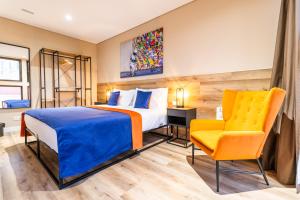 En eller flere senge i et værelse på CONDE13 Lisboa - Superior Charm Apartments