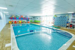 a large swimming pool in a large room at WC71 - Marlie Farm New Romney - Full bath in Kent