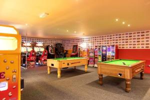 a room with two pool tables and other games at WC71 - Marlie Farm New Romney - Full bath in Kent