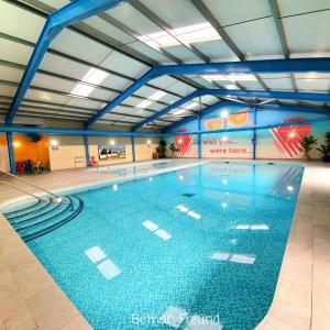 a large swimming pool in a building at BH14 - Marlie Holiday Park - New Romney in Kent