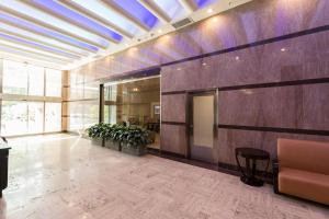an office lobby with aitating at French Quarter Splendor: 4BR Luxury Condo in New Orleans