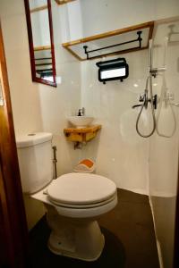 a bathroom with a white toilet and a sink at Odyssey of sunny side in Male City