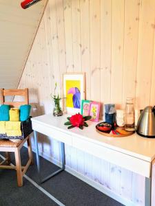 een witte tafel met daarop wat foto's bij 5min walk to LEGO House - two bedrooms on Loft floor with Balcony * with garden in Billund