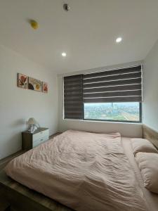 Will homestay, Nera Garden Huế tesisinde bir odada yatak veya yataklar