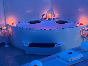 a room with a bath tub with lights in it at B&b house napoli capodichino in Naples