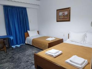 A bed or beds in a room at San Georgio Hotel