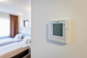 Postel nebo postele na pokoji v ubytování Arrabona Rooms