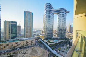 a view of a city with tall buildings at Burj Vista Burj Khalifa Metro & Mall Access in Dubai