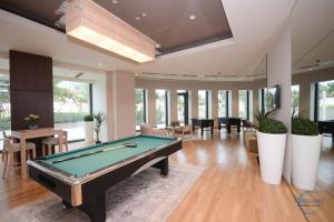 a living room with a pool table in it at Burj Vista Burj Khalifa Metro & Mall Access in Dubai