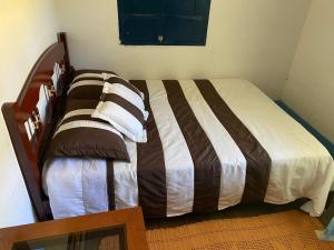 Кровать или кровати в номере Sítio paiol Velho