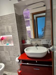 a bathroom with a sink and a mirror at Sergiunca in Bocca di Magra +50 photos