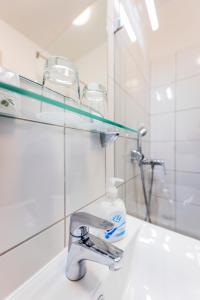 Koupelna v ubytování Arrabona Rooms