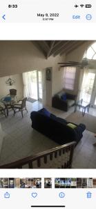 a living room with a couch and a table at Oceanfront Luxury 2Br Villa in Saint Philip