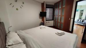 Ein Bett oder Betten in einem Zimmer der Unterkunft Terrasa de Mercado Central
