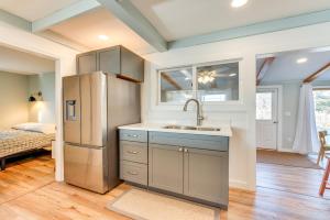a kitchen with a refrigerator and a sink at Beautiful Wells Cottage Steps to Moody Beach! in Wells