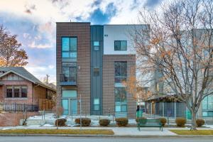 a building with a bench in front of it at Modern Townhome with Rooftop Deck - Near City Park! in Denver