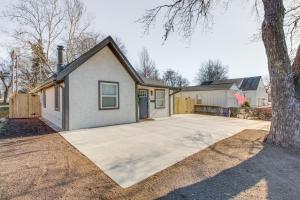a house with a large driveway in front of it at Modern and Stylish Olathe Home in Prime Location in Olathe