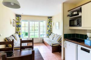 a living room with a couch and a table at Résidence Les Belles Rives - maeva Home - Appartement 2 pièces 5 personnes - Confort MAE-4474 in Argentat