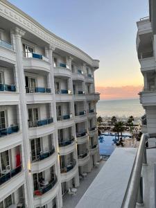 a large apartment building with a view of the ocean at Sevians Apartments in Golem