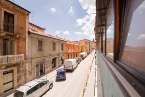 a view of a city street with cars on the road at ROOMS 66 in Campobasso