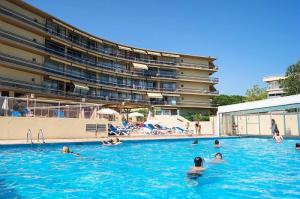 a group of people swimming in a swimming pool at Résidence Héliotel Marine - maeva Home - Studio 4 personnes - Confort MAE-5084 in Cros-de-Cagnes +7 photos