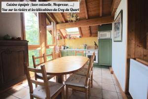 a kitchen with a wooden table and chairs at Chalet Du Regain - Chalet 4 pièces 8 personnes 3 exposé Sud-Ouest MAE-8244 in Valloire