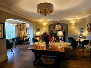 a living room with a couch and a table at Burlington Berties in Sheringham