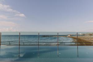 a view of the ocean from the balcony of a building at Don Gregory by Dunas - Adults Only in San Agustin