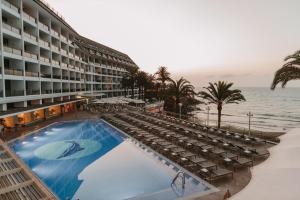 a hotel with a large swimming pool next to the beach at Don Gregory by Dunas - Adults Only in San Agustin