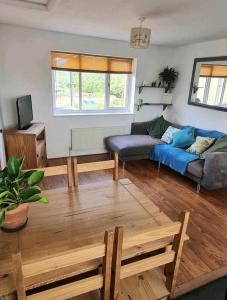 a living room with a couch and a table at Stunning 2-Bed House in Weston-super-Mare in Weston-super-Mare