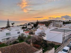 a view of a city at sunset at 2 bedrooms apartement at Luz 100 m away from the beach with terrace and wifi in Luz