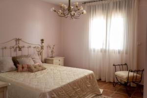 Prunera 5 - Benissa tesisinde bir odada yatak veya yataklar
