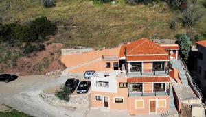 an aerial view of a house with a driveway at Arachova's Experience S2 in Arachova