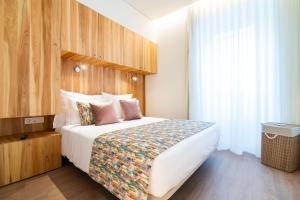 Säng eller sängar i ett rum på Azoriani City Hostel Ponta Delgada