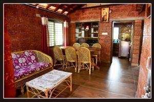 a dining room with a table and chairs at Tiny Waves in Udupi